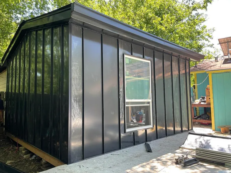 Black standing seam metal wall panels for Roof Inspection in West Des Moines