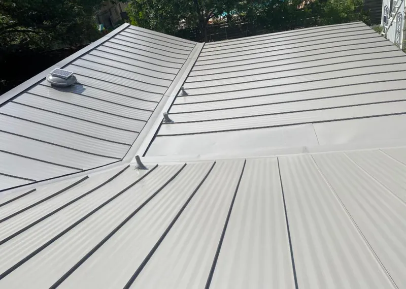 Solar attic fan installed on a metal roof for Roof Ventilation in West Des Moines